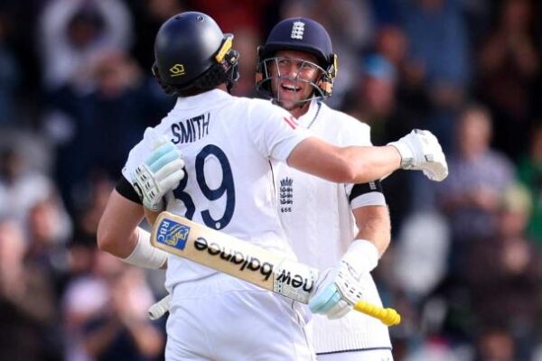 Joe Root and Jamie Smith of England celebrate winning the first Test of the five-match series against India in Leeds on Tuesday